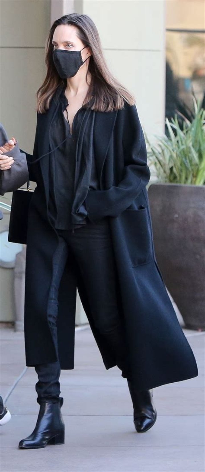 Angelina Jolie Stuns In Lacy Black Dress Under Long Coat While Leaving Event In L.A.