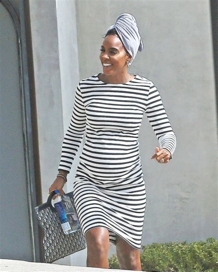 Kelly Rowland, 39, Shows Off Her Baby Bump In Striped Dress At Photo Shoot – Pics