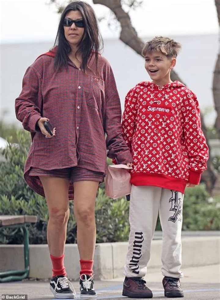 Kourtney Matches With Travis Barker & Kids In Black At ‘Kardashians’ Premiere