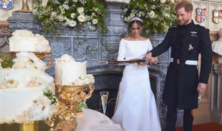 Prince Charles & Camilla Spotted With A Photo Of Prince Harry & Meghan Markle’s Wedding In Home