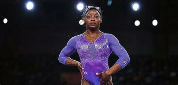 Simone Biles Rocks Sexy Backless Swimsuit & Admits She’s A ‘Happy Gal’